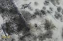 Still image taken from handout aerial footage shot by drone shows outline of an airplane in the snow at Sergey Prokofiev International Airport damaged by shelling during fighting between pro-Russian separatists and Ukrainian government forces, in Donetsk