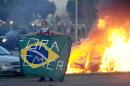 Students clash with police during a protest in front of the Congress in Brasilia on November 29, 2016 against the bill that freezes government spending for 20 years