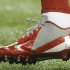 in this Sunday, Dec. 16, 2012, photo, a shoe worn by New York Giants wide receiver Victor Cruz bears a message dedicated to 6-year-old Jack Pinto, one of the victims in last week's school shootings at Sandy Hook Elementary School in Newtown, Conn., as Cruz warms up for the Giants' NFL football game against the Atlanta Falcons in Atlanta. (AP Photo/John Amis)