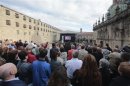 People watch the funeral in memory of the victims of the July 24, 2013 train crash, on a screen outside the Cathedral of Santiago de Compostela