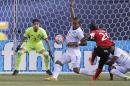 Panama's Roman Torres (5) deflects a shot by Trinidad & Tobago's Keron Cummings (20) as goalkeeper Jaime Penedo (1) watches during the second half of a CONCACAF Gold Cup soccer match Sunday, July 19, 2015, at MetLife stadium in East Rutherford, N.J. (AP Photo/Mel Evans)
