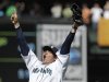 Seattle Mariners pitcher Felix Hernandez celebrates after throwing a perfect game against the Tampa Bay Rays, in a baseball game Wednesday, Aug. 15, 2012, in Seattle. (AP Photo/Ted S. Warren)