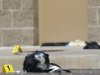 Yellow markers sit next to evidence, including a gas mask, as police investigate the scene outside the Century 16 movie theater east of the Aurora Mall in Aurora, Colo. on Friday, July 20, 2012. A gunman in a gas mask barged into a crowded Denver-area theater during a midnight showing of the Batman movie on Friday, hurled a gas canister and then opened fire in one of the deadliest mass shootings in recent U.S. history. (AP Photo/David Zalubowski)