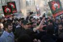 Tehran's police chief Hossein Sajedinia (C) asks protesters to end their rally against the execution of prominent Shiite Muslim cleric Nimr al-Nimr by Saudi authorities, and leave the area outside the Saudi embassy on January 3, 2016, in Tehran