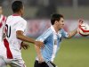 Argentina's Messi and Peru's Ramirez fight for the ball during their 2014 World Cup qualifying soccer match in Lima