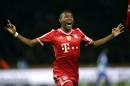 Bayern's David Alaba of Austria celebrates his team's opening goal scored by Toni Kroos during the German Bundesliga soccer match between Hertha BSC Berlin and Bayern Munich in Berlin, Germany, Tuesday, March 25, 2014. (AP Photo/Michael Sohn)