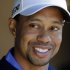 Tiger Woods smiles during a news conference before playing a practice round for the Match Play Championship golf tournament, Tuesday, Feb. 19, 2013, in Marana, Ariz. (AP Photo/Julie Jacobson)