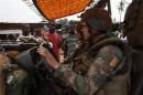 Angry young men complain to French soldiers on patrol in the pro-Christian area of Bangui