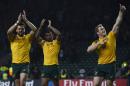 From L: Australia's wing Adam Ashley-Cooper, fly half Kurtley Beale and number 8 David Pocock celebrate after winning a Pool A match of the 2015 Rugby World Cup against England at Twickenham stadium, south west London, on October 3, 2015
