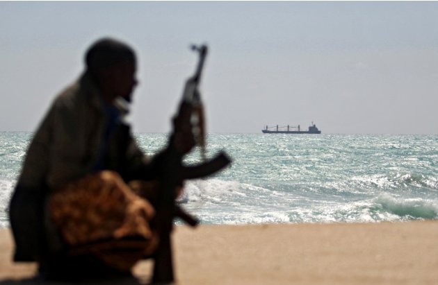 An armed pirate is pictured on the shores of Hobyo town, in northeastern Somalia, in 2010