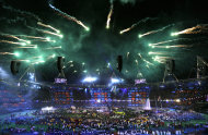 Fireworks explode over the stadium as rock band Coldplay perform at the closing ceremony for the 2012 Paralympics, Sunday, Sept. 9, 2012, in London. (AP Photo/Kirsty Wigglesworth)
