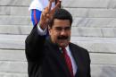 Venezuela's President Nicolas Maduro flashes a victory sign as he arrives at the 7th Summit of Heads of State for the Association of Caribbean States (ACS) in Havana, Cuba