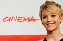 A photo taken on November 14, 2013 shows US actress Jennifer Lawrence posing during a photocall for of the film "The Hunger Games: catching Fire'' at the Rome International Film Festival