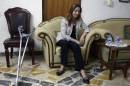 Iraq's only Yazidi member of parliament, Vian Dakhil, looks down during an interview on September 20, 2014, in Arbil, Iraq