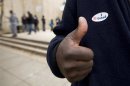 Voter gives thumb's up after voting in the Anacostia neighborhood of Washington
