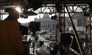 A technician works on structure set up for TV media in front of St. Peter's Square in Rome February 26, 2013. Pope Benedict will keep the honorific title of "His Holiness" after he abdicates this week and will be known as "pope emeritus," the Vatican said on Tuesday. REUTERS/Alessandro Bianchi