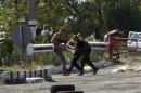 Ukrainian servicemen detain a pro-Russian activist at a checkpoint near Debaltseve