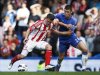 Chelsea's Cahill challenges Stoke City's Owen during their English Premier league soccer match at Stamford Bridge in London