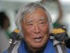80-year-old Japanese climber Yuichiro Miura, who became the oldest conqueror of Mount Everest on last Thursday, speaks to media  upon his arrival at Haneda International Airport in Tokyo, Wednesday, May 29, 2013. Miura, a Japanese former extreme skier, conquered the mountain on May 23 despite undergoing heart surgery in January for an irregular heartbeat, or arrhythmia, his fourth heart operation since 2007. He also broke his pelvis and left thigh bone in a 2009 skiing accident. (AP Photo/Itsuo Inouye)
