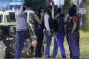 French policemen take part in a police raid in Boussy-Saint-Antoine near Paris