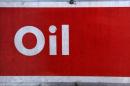 The word oil is pictured on an oil bank at a recycling yard in London