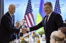 U.S. Vice President Biden shakes hands with Ukraine's President Poroshenko before their bilateral meeting at the Nuclear Security Summit in Washington