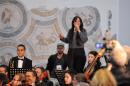Singer Yosra Mahnouch performs with the Tunisian Symphony Orchestra at the National Bardo Museum in Tunis on March 24, 2015, during an official ceremony honouring the 21 people killed in last week's jihadist attack