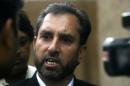 Afridi, lawyer for a Pakistani doctor who helped U.S. officials find al-Qaeda chief Osama bin laden, speaks to the media in Peshawar