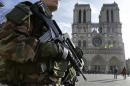 An armed French soldier patrols in front of Notre Dame Cathedral in Paris