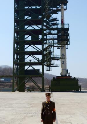 A North Korean guard stands in front of the Unha-3&nbsp;&hellip;