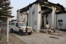 A vehicle is parked in front of a damaged building at Medecins Sans Frontieres (MSF) in Kunduz, Afghanistan