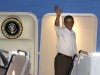 President Barack Obama waves as he boards Air Force One to return to Washington, at Honolulu Joint Base Pearl Harbor-Hickam in Honolulu, after spending Christmas with his family in Hawaii, Wednesday, Dec. 26, 2012. (AP Photo/Gerald Herbert)