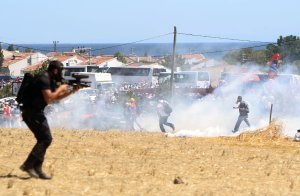 Riot and paramilitary police officers fire tear gas …