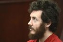 Accused Aurora theater shooting suspect James Holmes listens at his arraignment in Centennial