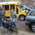 Peter Curry, center, unloads his daughter's wheel chair from his car after driving her to Public School 33, Wednesday, Jan. 16, 2013 in New York. She would normally be driven by school bus, according to her father. More than 8,000 New York City school bus drivers and aides went on strike over job protection Wednesday morning, leaving some 152,000 students, many disabled, trying to find other ways to get to school. (AP Photo/Mark Lennihan)