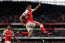 Arsenal's Alexis Sanchez celebrates after scoring the opening goal during the English Premier League soccer match between Arsenal and Chelsea at the Emirates Stadium in London, Saturday, Sept. 24, 2016. (AP Photo/Matt Dunham)