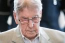 Former Auschwitz guard Reinhold Hanning is accused of complicity in the murders of tens of thousands of people at the Nazi concentration camp during World War II