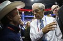 Rep. Ron Paul, R-Texas, talks with a Texas delegate on the floor at the Republican National Convention in Tampa, Fla., on Tuesday, Aug. 28, 2012. (AP Photo/Jae C. Hong)