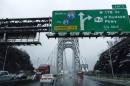 Cars make their way through the Washington bridge in New York