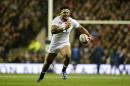 England's centre Manu Tuilagi runs with the ball toward the try line during the Six Nations international rugby union match between England and France at Twickenham Stadium in south-west London on February 23, 2013