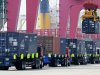 FILE - In this Wednesday, April 10, 2013 file photo, a shipping container is craned to a containership at a port in Qingdao in east China's Shandong province. China's trade accelerated in April in a possible positive sign for its shaky economic recovery. Exports rose 14.7 percent over a year earlier, up from March's 10 percent growth, customs data showed Wednesday, May 8. Imports gained 16.8 percent, up from the previous month's 14.1 percent. (AP Photo/File) CHINA OUT