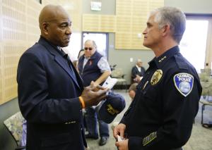 Olympia Police Chief Ronnie Roberts, right, talks with &hellip;