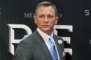 FILE - In this Nov. 2, 2015 file photo, actor Daniel Craig walks the red carpet at the regional premiere of the latest James Bond film, "Spectre," in Mexico City. On Monday, April 4, 2016, Craig called for more funding for the U.N. agency that cleans up of mines and other unexploded ordnance, saying the work it does increases the chances of survival for people in conflict zones around the world. (AP Photo/Rebecca Blackwell, File)