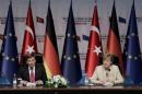German Chancellor Angela Merkel (R) and Turkish Prime Minister Ahmet Davutoglu (L) give a press conference after visiting the Nizip refugee camp in Gaziantep on April 23, 2016