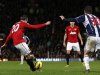 Manchester United's Robin van Persie scores against West Bromwich Albion during their English Premier League soccer match at Old Trafford in Manchester