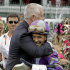 Trainer Todd Pletcher hugs jockey Mike Smith after Smith rode Princess of Sylmar to a win in the 139th Kentucky Oaks at Churchill Downs Friday, May 3, 2013, in Louisville, Ky.(AP Photo/Garry Jones)