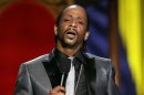 In this Sunday, July 22, 2007 photo, Katt Williams performs onstage during the "Comedy Central Roast of Flavor Flav," in Burbank, Calif. Williams found himself on the wrong side of the law after being arrested in Los Angeles, Friday, Dec. 28, 2012, on suspicion of child endangerment and possession of a stolen gun. Police Officer Norma Eisenman says Williams was taken into custody Friday after the Los Angeles County Department of Children and Family Services did a welfare check at his home. Authorities found more than one firearm, one of which had been reported stolen. (AP Photo/Matt Sayles)