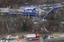 Aerial view of rescue teams at the site where two trains collided head-on near Bad Aibling, Germany, Tuesday, Feb. 9, 2016. Several people have been killed and dozens were injured. (AP Photo/Matthias Schrader)