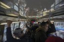 Commuters ride the bus in the Brooklyn Borough of New York