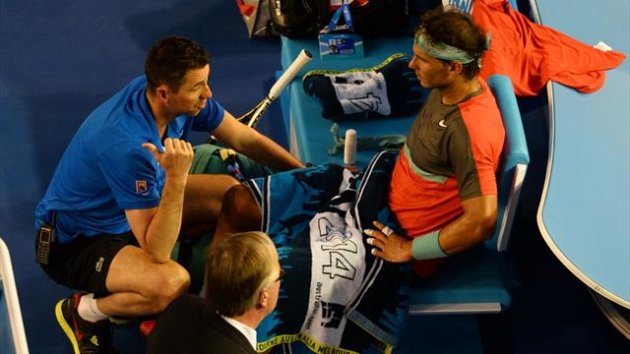 Spain's Rafael Nadal (R) sits during an injury time out during his men's singles final against Switzerland's Stanislas Wawrinka (Getty Images)